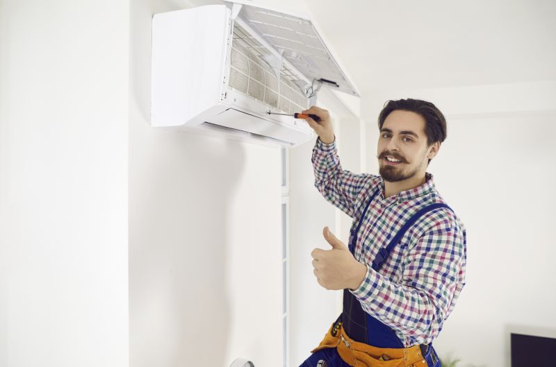 Technician Repairing Portable AC